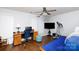 Bedroom featuring a ceiling fan, hardwood flooring, a computer desk, and an elliptical machine at 609 Atherton Way, Rock Hill, SC 29730