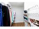 Organized walk-in closet featuring hanging clothes, shoe racks, and hardwood floors at 609 Atherton Way, Rock Hill, SC 29730