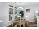 Bright dining area with a modern light fixture and large windows at 609 Atherton Way, Rock Hill, SC 29730