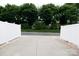 This home's driveway is fenced-in with a view of manicured greenery at 609 Atherton Way, Rock Hill, SC 29730