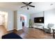 Bright living room featuring hardwood floors, neutral walls, and ceiling fan, with an open entrance to the kitchen at 609 Atherton Way, Rock Hill, SC 29730