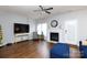 Spacious living room featuring a fireplace, hardwood flooring and ceiling fan at 609 Atherton Way, Rock Hill, SC 29730