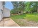 Backyard with trees and fencing offers plenty of space for outdoor enjoyment at 6221 Round Hill Rd, Charlotte, NC 28211