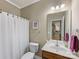 Bathroom with a shower-tub combo, vanity, and decor at 6619 Hermsley Rd, Charlotte, NC 28278