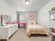 Cozy bedroom features neutral walls, carpeted floors, a pink desk and a white dresser at 6619 Hermsley Rd, Charlotte, NC 28278