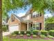 Charming two-story brick home with a well-manicured lawn and attached two-car garage at 6619 Hermsley Rd, Charlotte, NC 28278