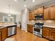 Modern kitchen with stainless steel appliances, ample cabinet space, and a convenient layout for cooking at 6619 Hermsley Rd, Charlotte, NC 28278