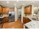 Well-appointed kitchen featuring stainless steel appliances, granite countertops, and rich wood cabinetry at 6619 Hermsley Rd, Charlotte, NC 28278