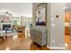 Inviting open-concept living space featuring hardwood floors, stylish decor, and access to other rooms at 6619 Hermsley Rd, Charlotte, NC 28278