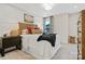 Nicely decorated bedroom with a wooden headboard, and a nightstand with a lamp and a blanket on the bed at 7101 Short Stirrup Ln, Mint Hill, NC 28227