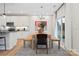 Stylish dining area featuring a wooden table, bench seating, and modern decor at 7101 Short Stirrup Ln, Mint Hill, NC 28227