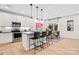 Open kitchen and dining area with stainless appliances, sleek countertops, and modern decor at 7101 Short Stirrup Ln, Mint Hill, NC 28227