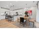 Bright, open kitchen with stainless steel appliances, modern lighting, and an adjacent dining area at 7101 Short Stirrup Ln, Mint Hill, NC 28227