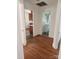 Hallway view showcasing the flooring and access to the kitchen and bathroom at 76 Sumner Nw Ave, Concord, NC 28027