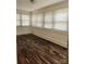 Bright living room with hardwood-style floors and lots of natural light at 76 Sumner Nw Ave, Concord, NC 28027