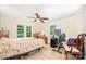 Spacious bedroom filled with natural light, hardwood floors, and ceiling fan at 8334 Oaktree Rd, Sharon, SC 29742
