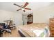 Bright bedroom includes wood furniture, hardwood floors, and ceiling fan at 8334 Oaktree Rd, Sharon, SC 29742