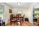 Cozy dining room with wood flooring, a classic wooden table, and comfortable seating at 8334 Oaktree Rd, Sharon, SC 29742