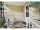Cozy front porch with white rocking chairs and vintage charm at 8334 Oaktree Rd, Sharon, SC 29742