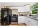 Well-equipped kitchen with modern black appliances and ample countertop space at 8334 Oaktree Rd, Sharon, SC 29742