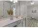 Bright bathroom showcasing a white vanity, decorative mirror and neutral walls at 8725 Soaring Eagle Ln, Waxhaw, NC 28173