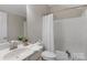 Bright bathroom featuring a combination shower and tub at 8725 Soaring Eagle Ln, Waxhaw, NC 28173