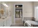 Bright bathroom showcasing a soaking tub and a view into a bedroom at 8725 Soaring Eagle Ln, Waxhaw, NC 28173