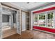Bonus room with hardwood floors, built-in shelves, and a large window at 8725 Soaring Eagle Ln, Waxhaw, NC 28173