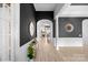 Stately hallway with hardwood floors, archways, and decorative accents at 8725 Soaring Eagle Ln, Waxhaw, NC 28173