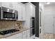Kitchen featuring stainless steel microwave, gas range, and double oven at 8725 Soaring Eagle Ln, Waxhaw, NC 28173