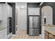 Kitchen featuring stainless steel refrigerator and built-in ovens at 8725 Soaring Eagle Ln, Waxhaw, NC 28173