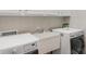 Laundry room with sink and adjacent washer and dryer at 8725 Soaring Eagle Ln, Waxhaw, NC 28173