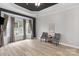 Living room with decorative fireplace and windows at 8725 Soaring Eagle Ln, Waxhaw, NC 28173