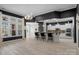 View of the modern open floor plan featuring wood floors and an open kitchen at 8725 Soaring Eagle Ln, Waxhaw, NC 28173