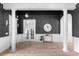 Bright living room with light-colored floors, white columns, and tasteful decor at 8725 Soaring Eagle Ln, Waxhaw, NC 28173