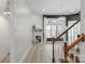 Cozy living room with fireplace, large windows, and staircase at 8725 Soaring Eagle Ln, Waxhaw, NC 28173
