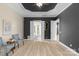 Spacious main bedroom with tray ceiling, sitting area, and double doors to bathroom at 8725 Soaring Eagle Ln, Waxhaw, NC 28173