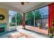 Covered patio overlooking landscaped backyard with a brick patio and fire pit at 8725 Soaring Eagle Ln, Waxhaw, NC 28173