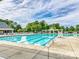Large community pool with ample seating and umbrellas at 8725 Soaring Eagle Ln, Waxhaw, NC 28173