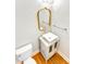 Stylish powder room with modern vanity, faucet and lighting at 8803 Sweetwater Pl, Waxhaw, NC 28173