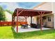 Outdoor living space with covered patio, dining area, and comfortable seating at 9805 Coatbridge Dr, Charlotte, NC 28269