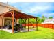 An eye-level shot of the backyard featuring a patio with an outdoor kitchen at 9805 Coatbridge Dr, Charlotte, NC 28269