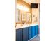 This gorgeous bathroom has a double vanity with a wood accent wall at 9805 Coatbridge Dr, Charlotte, NC 28269