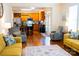 Cozy living room with hardwood floors, comfortable seating, and an open view into the modern kitchen at 9805 Coatbridge Dr, Charlotte, NC 28269