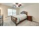 Bedroom with neutral walls, plush carpet, ceiling fan, and natural light at 1003 Silver Spring Rd, Fort Mill, SC 29715
