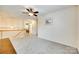 Upstairs bonus room with neutral carpet, chandelier, and natural light at 1003 Silver Spring Rd, Fort Mill, SC 29715