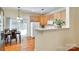 Bright dining area with sliding glass doors, adjacent to a modern kitchen with wood cabinets at 1003 Silver Spring Rd, Fort Mill, SC 29715