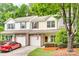 Charming townhome exterior with well-manicured landscaping and attached garage at 1003 Silver Spring Rd, Fort Mill, SC 29715