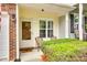 Cozy front porch with outdoor seating and well-kept landscaping for a welcoming entrance at 1003 Silver Spring Rd, Fort Mill, SC 29715