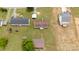 A top-down aerial view of the back of the property, featuring the outdoor deck and outbuildings at 1007 W Cabaniss Rd, Shelby, NC 28150